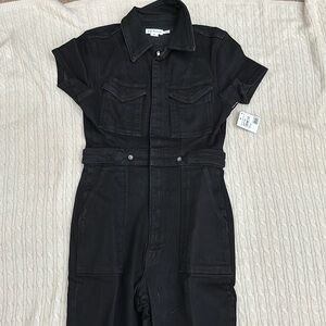 Brand new. Never worn Good American black Jean jumpsuit